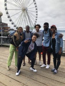 Counselors and hip hop artist in front of Seattle's Great Wheel.
